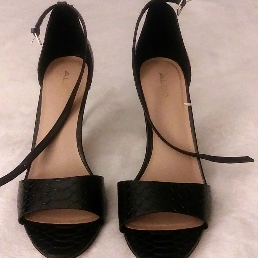 I am selling a size 11 pair of shoes, black in color, and made by Aldo.